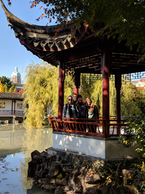 NU students in Chinese garden veranda in Vancouver. View 1
